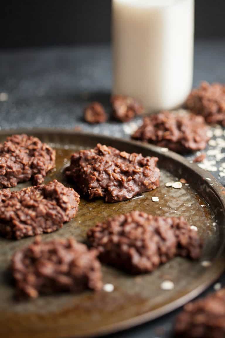 no bake cookies on a table with a big glass of milk