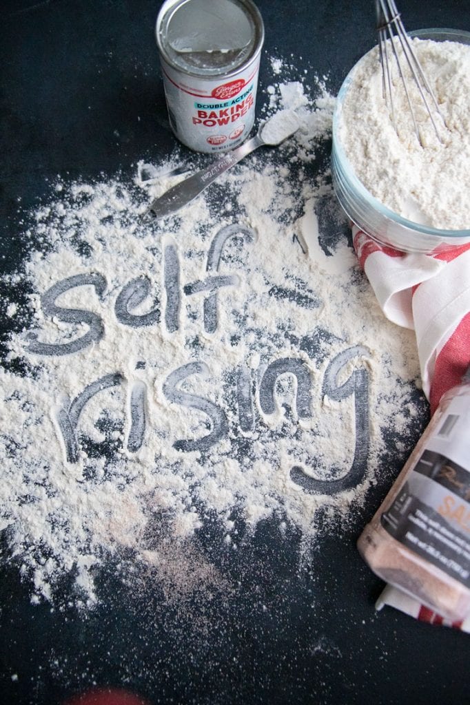 the word self rising written in flour on  a board