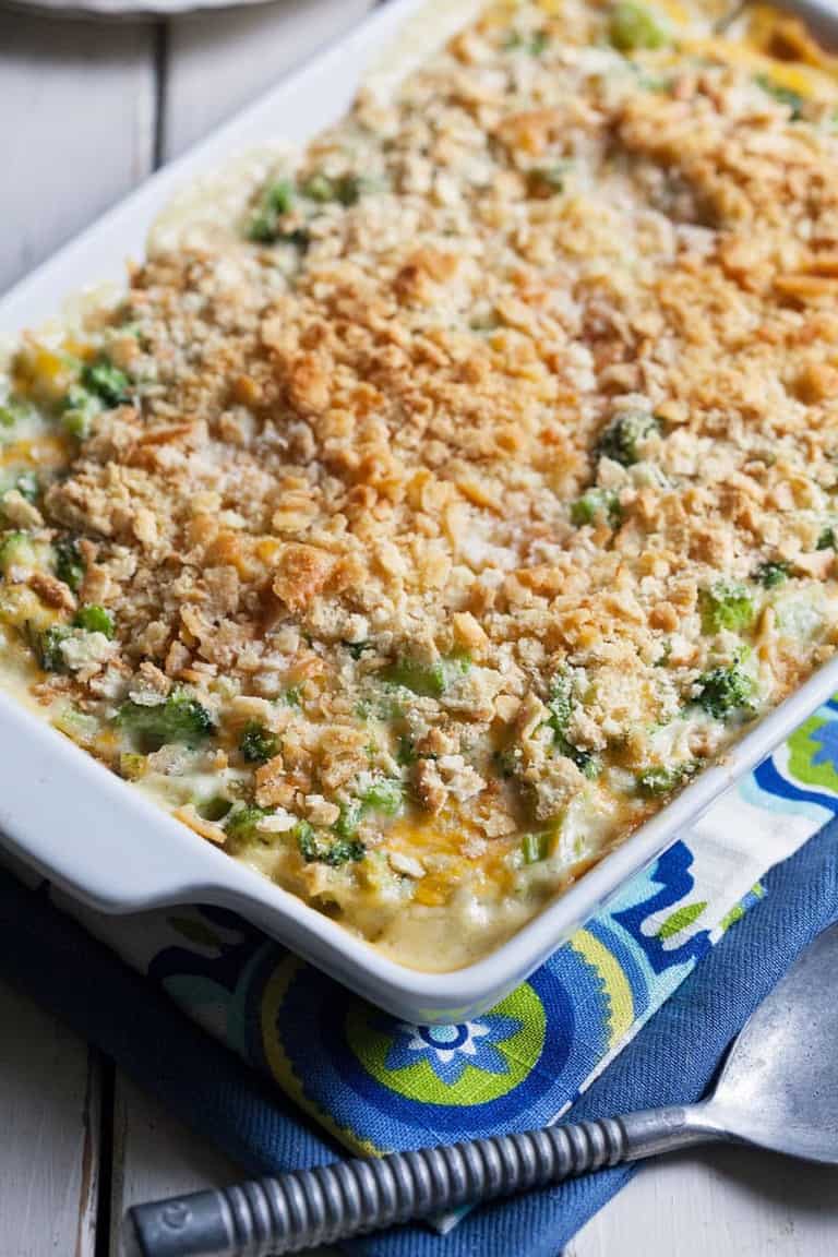 a close up of broccoli casserole in a baking dish 