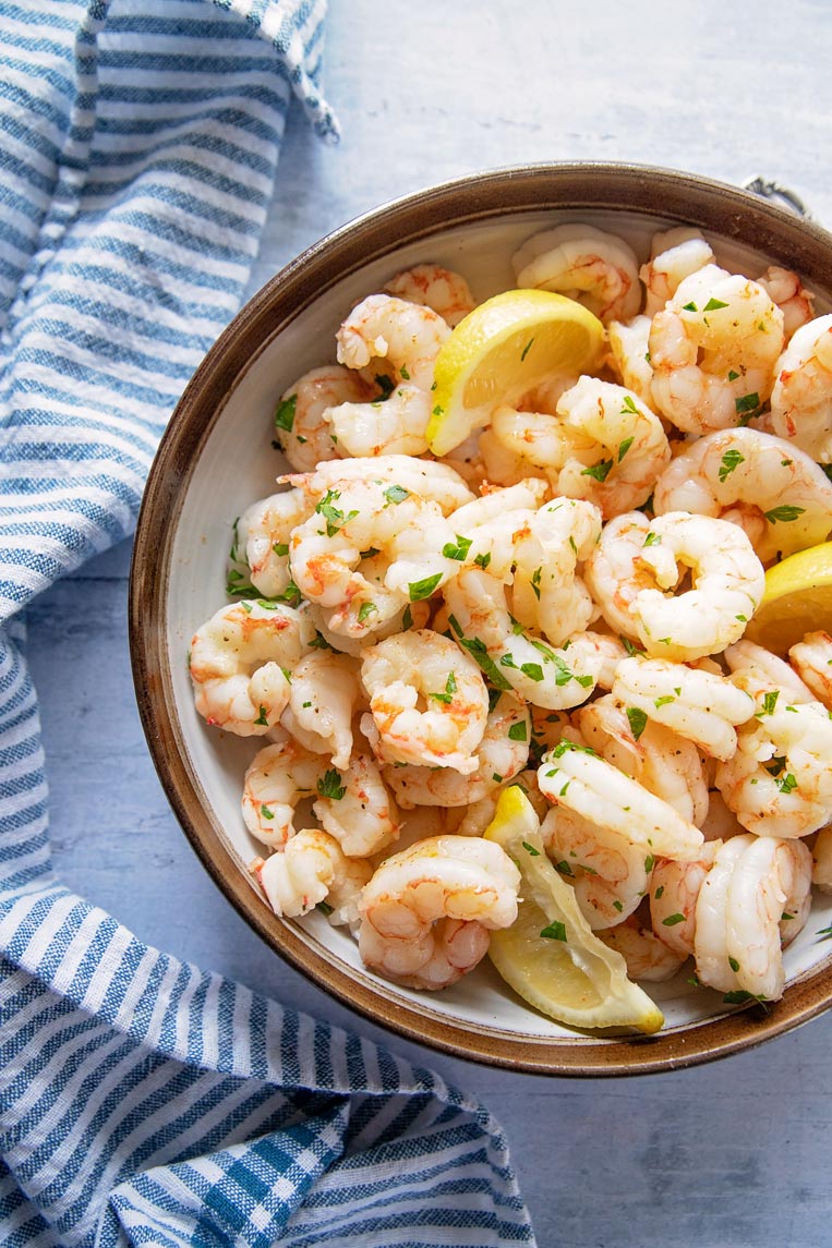 a bowl of buttered and herb shrimp 