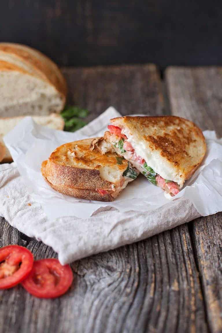 It's all that is tasty about spring rolled up in a gooey, cheesy, melty hot sandwich. Caprese grilled cheese is just the way to do it.