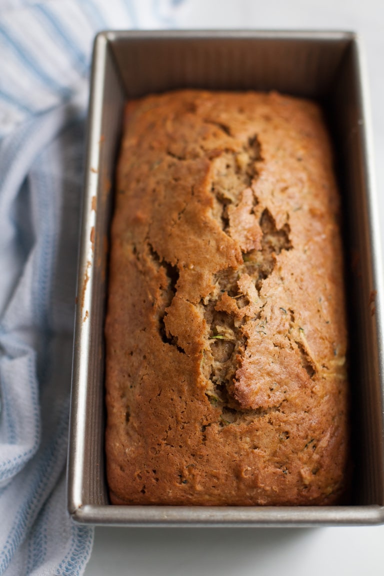 a whole loaf of zucchini bread in a baking pan